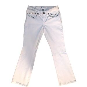White flare jeans bedazzled with gemstones, size 6 material spandex, and cotton.